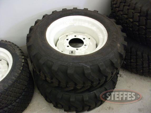 (2) Titan Trac Loader tires on wheels_1.jpg